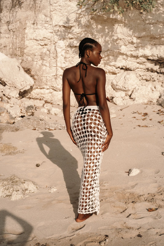 Daisy Skirt in Ivory - fitted body-con open-weave crochet maxi with knit waistband and front center slit, back view | NYALA