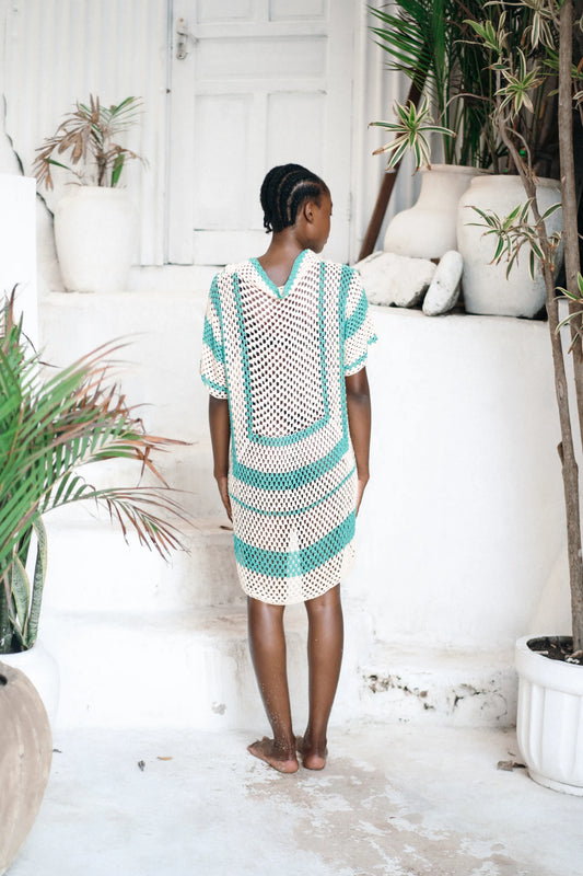 Savera Dress in teal wave motif - loose-fit two-tone crochet mini with button front, patch pockets and V-neckline, back view | NYALA