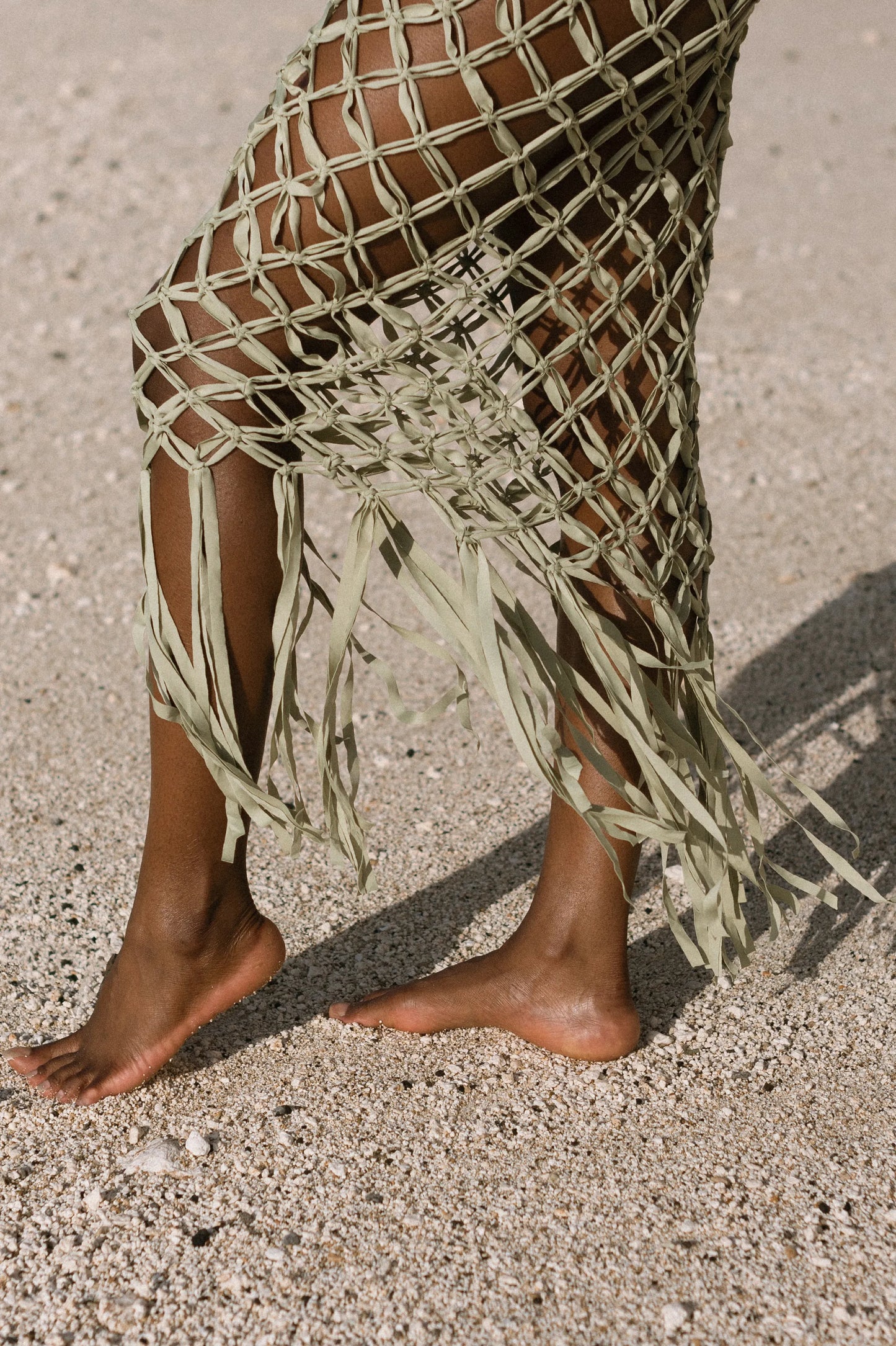 Ahana Dress in Olive – handcrafted macramé maxi dress with tassel hem, detail side view | NYALA