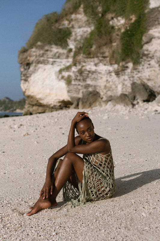 Ahana Dress in Olive – handcrafted macramé maxi dress with tassel hem, side view | NYALA