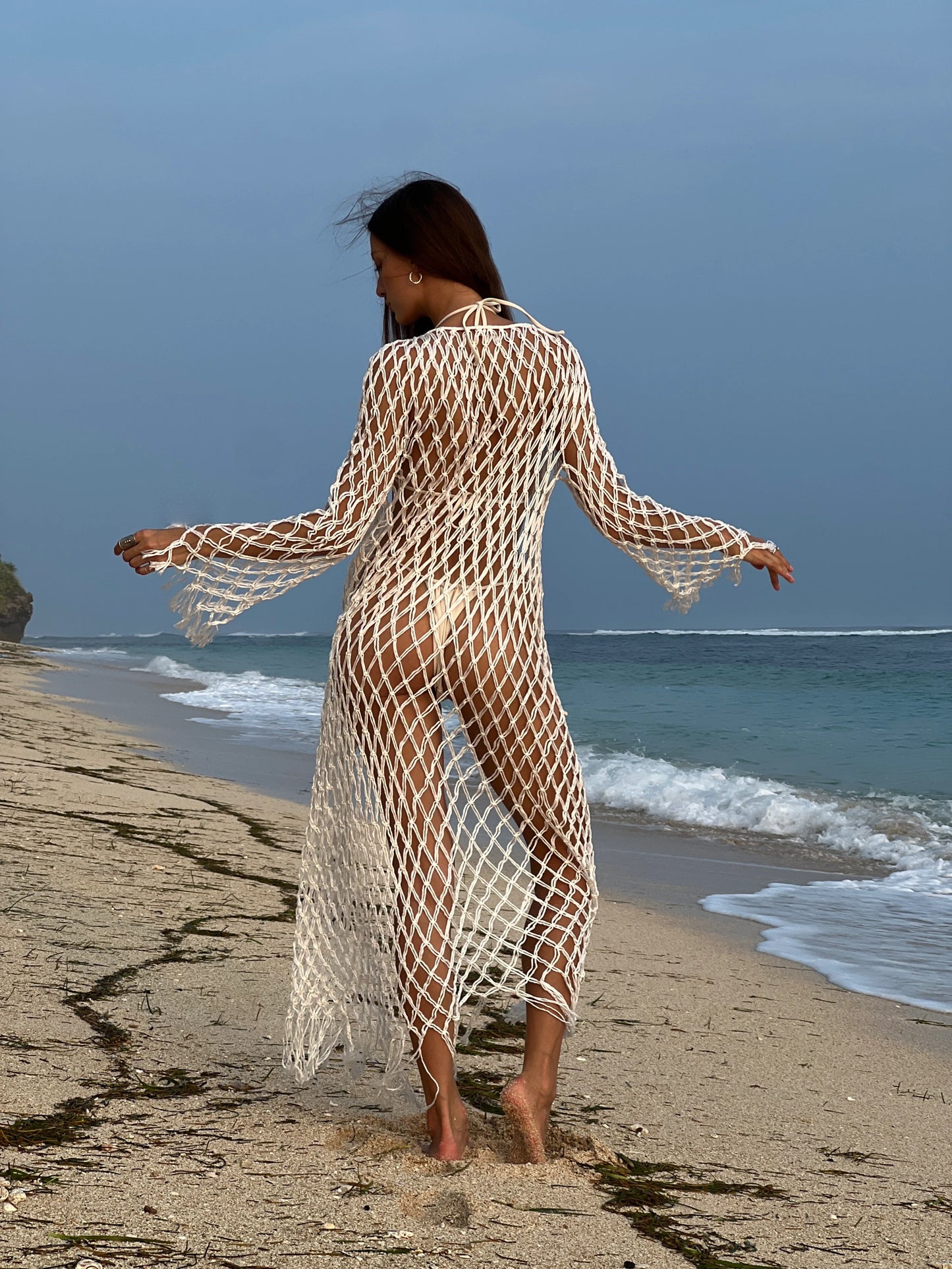 Aoloa Cardigan in Ivory — handcrafted diamond net macramé maxi cardigan with fringe hem, back view | NYALA