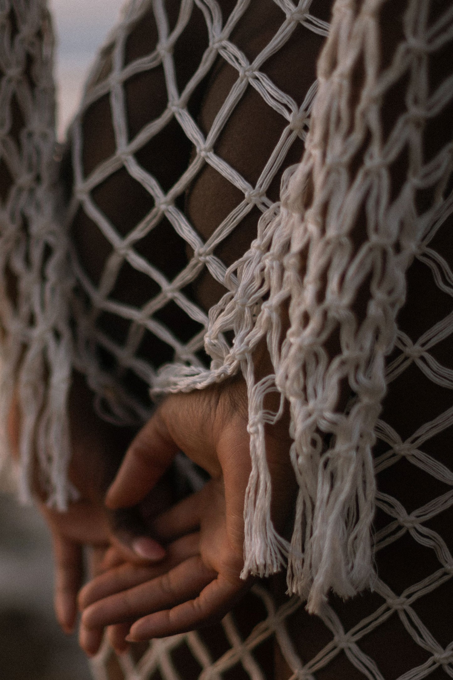 Aoloa Cardigan in Ivory — handcrafted diamond net macramé maxi cardigan with fringe hem, detail view | NYALA