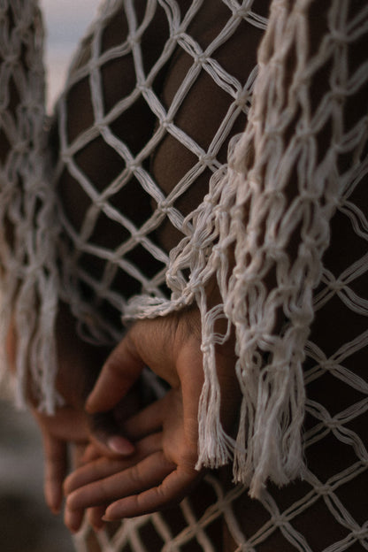 Aoloa Cardigan in Ivory — handcrafted diamond net macramé maxi cardigan with fringe hem, detail view | NYALA
