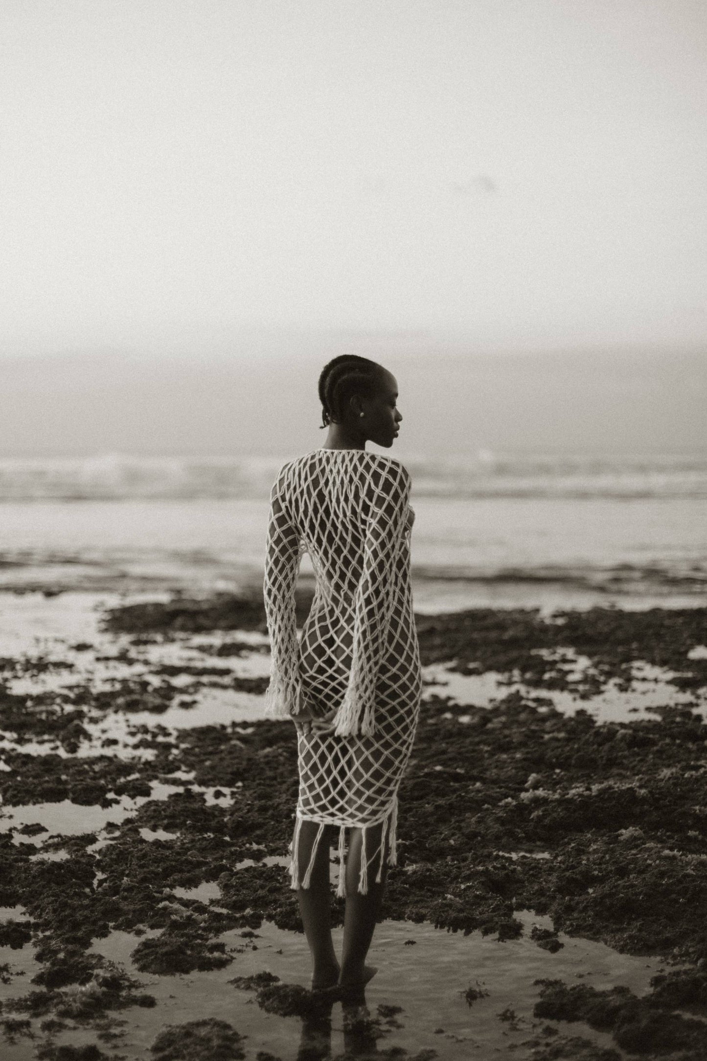 Aoloa Cardigan in Ivory — handcrafted diamond net macramé maxi cardigan with fringe hem, back view | NYALA