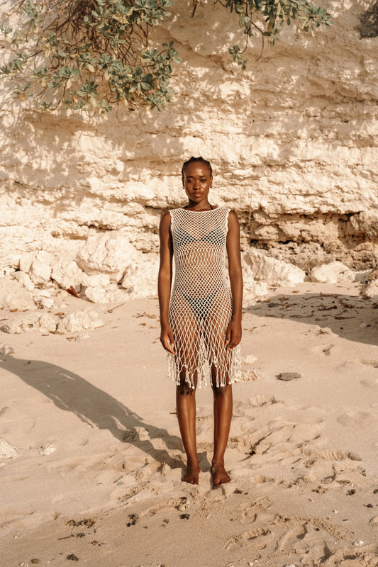 Binar Dress in Ivory - sleeveless fishnet crochet mini with dramatic fringe hem, front view | NYALA