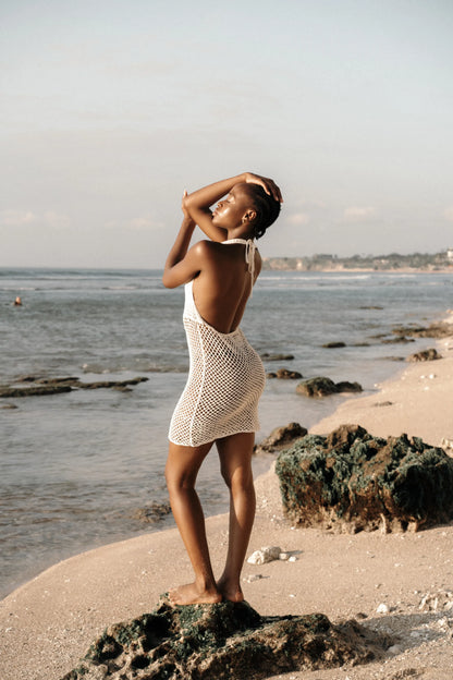 Pallavi Dress in Ivory - crochet knee dress with open back, side view | NYALA