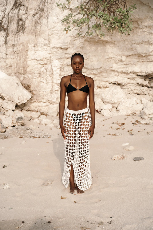 Daisy Skirt in Ivory - fitted body-con open-weave crochet maxi with knit waistband and front center slit, front view | NYALA