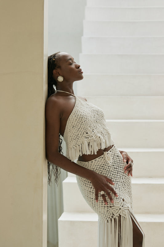 Haima Set in Ivory - macramé halter crop top and fringe mini skirt with long tassel hem, side view | NYALA