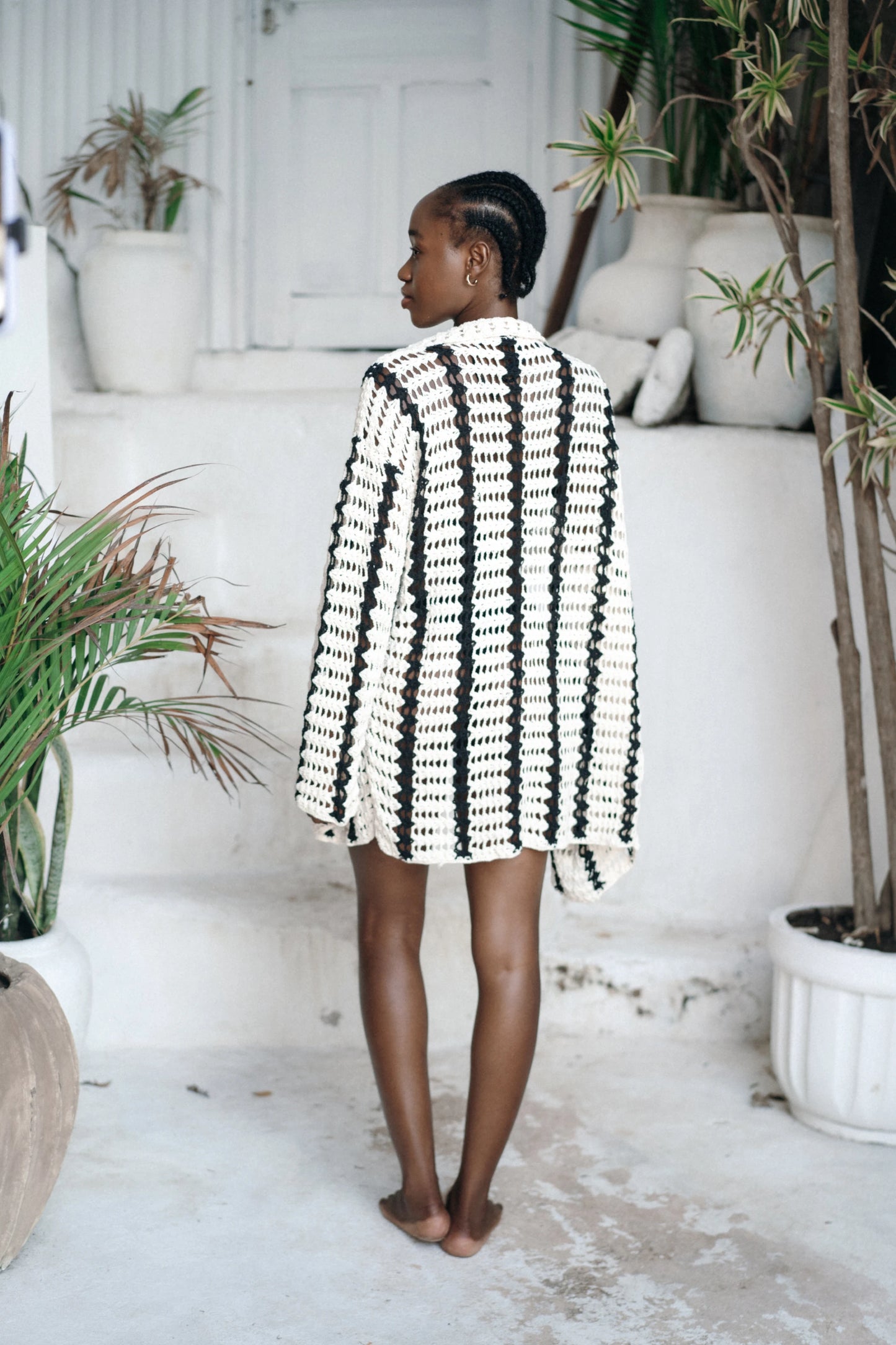 Kelana Cardigan in cream-and-black striped - open-front crochet cardigan with long sleeves, back view | NYALA
