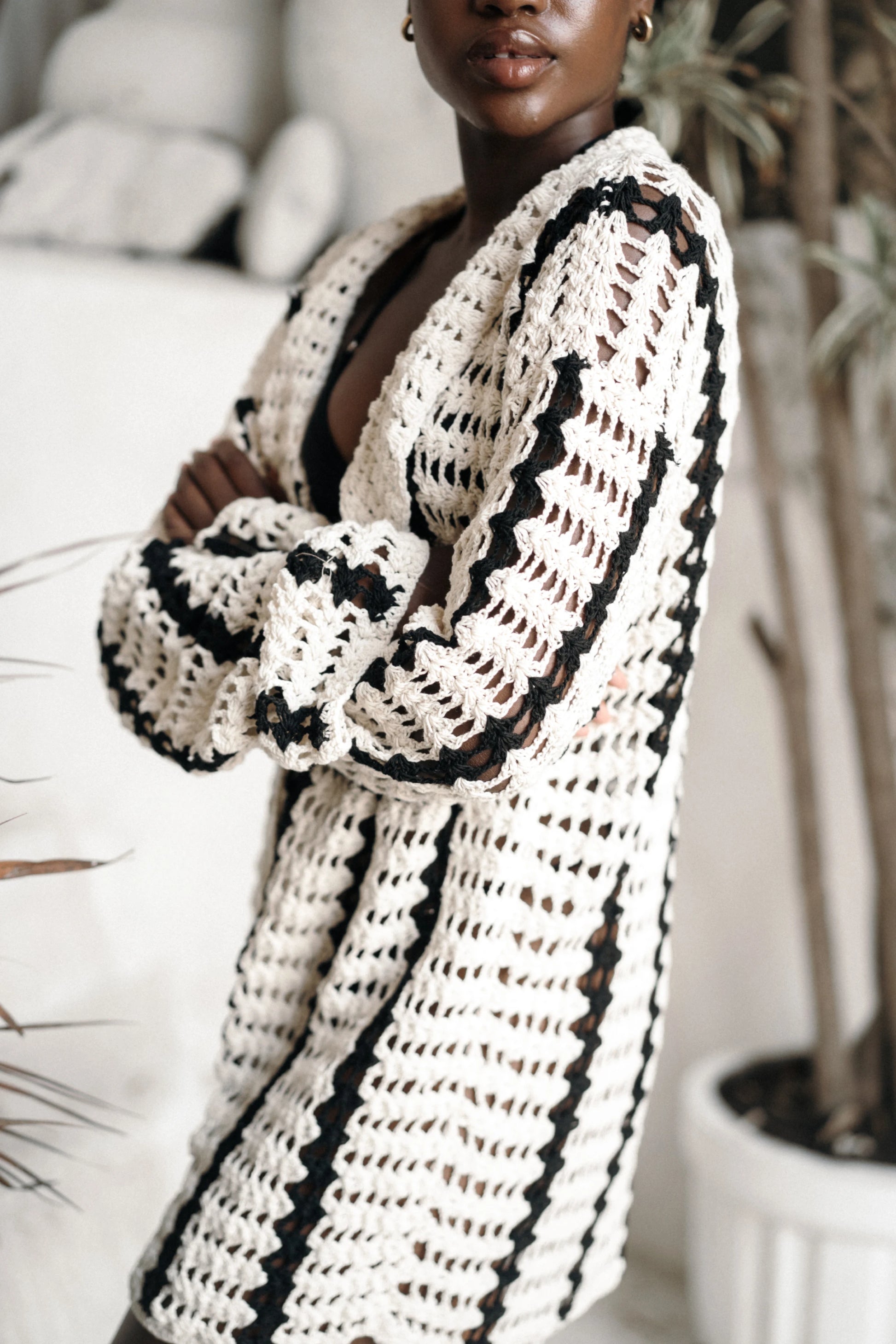 Kelana Cardigan in cream-and-black striped - open-front crochet cardigan with long sleeves, close view | NYALA