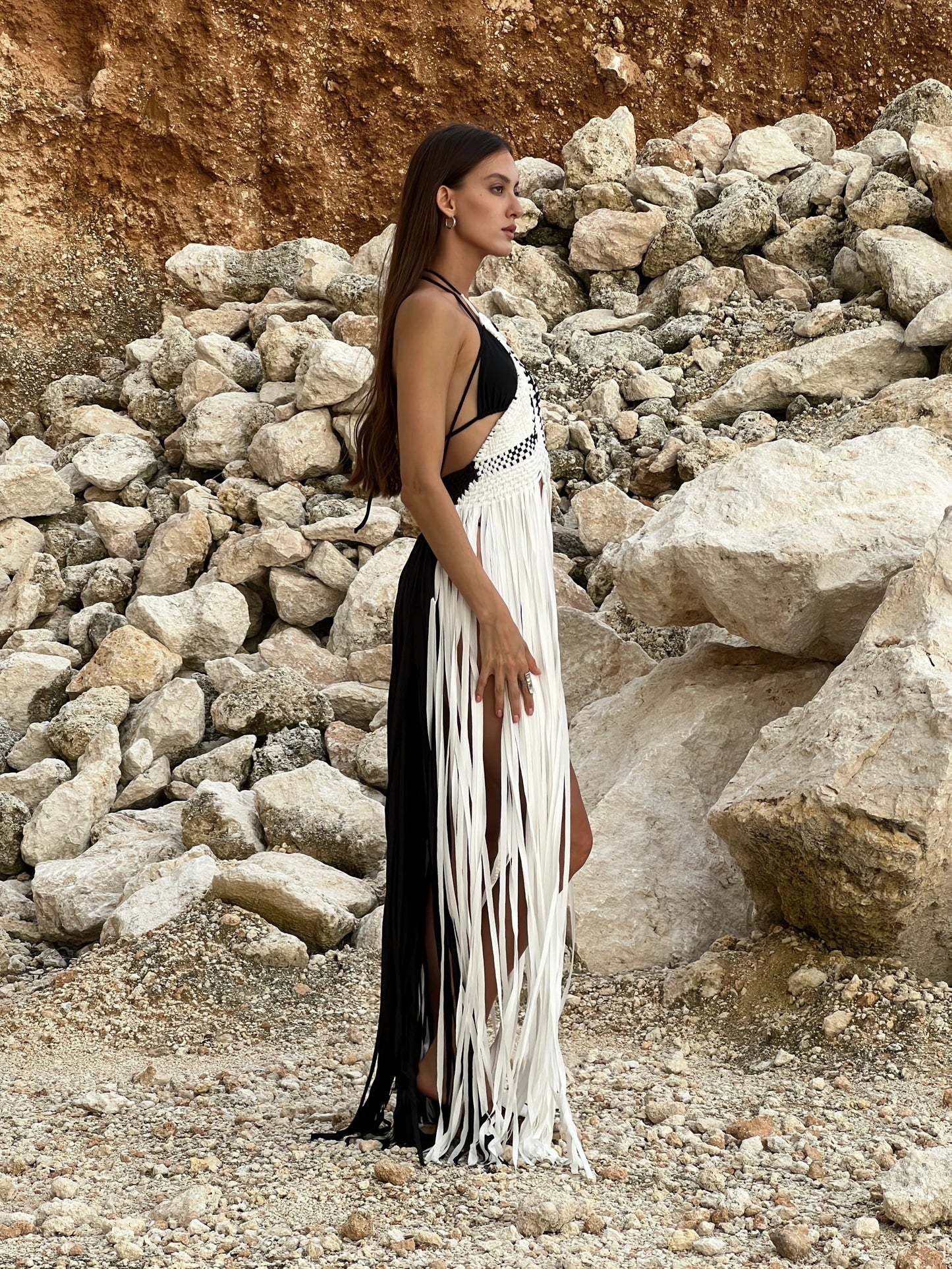 Tropical Dress in Monochrome - macrame halter cover-up with knotwork bodice, deep V front, lace-up back and floor-length fringe, side view | NYALA