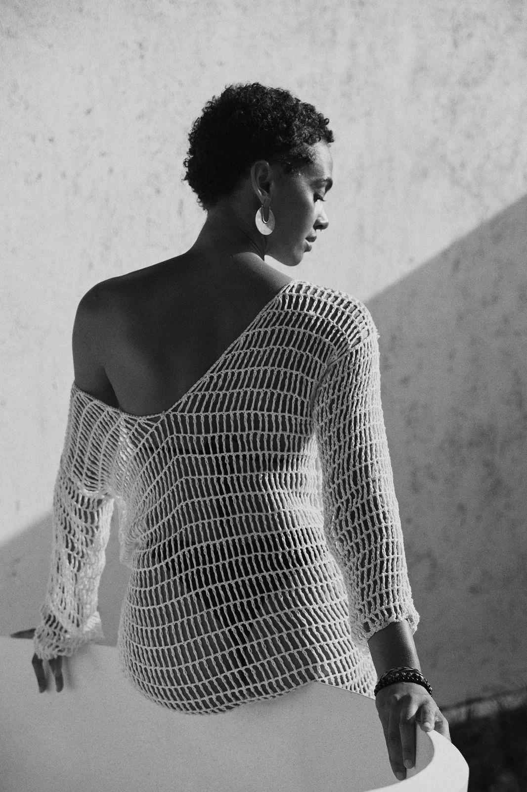 Venila Dress in Ivory - form-fitting long sleeve fishnet crochet midi, back view  | NYALA