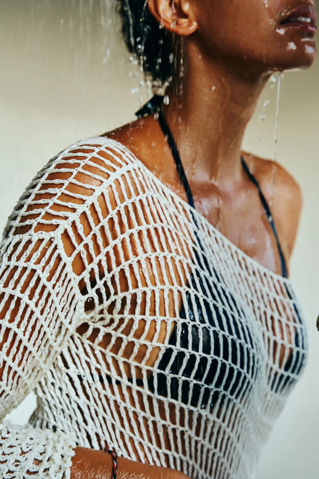 Venila Dress in Ivory - form-fitting long sleeve fishnet crochet midi, cropped close side view  | NYALA