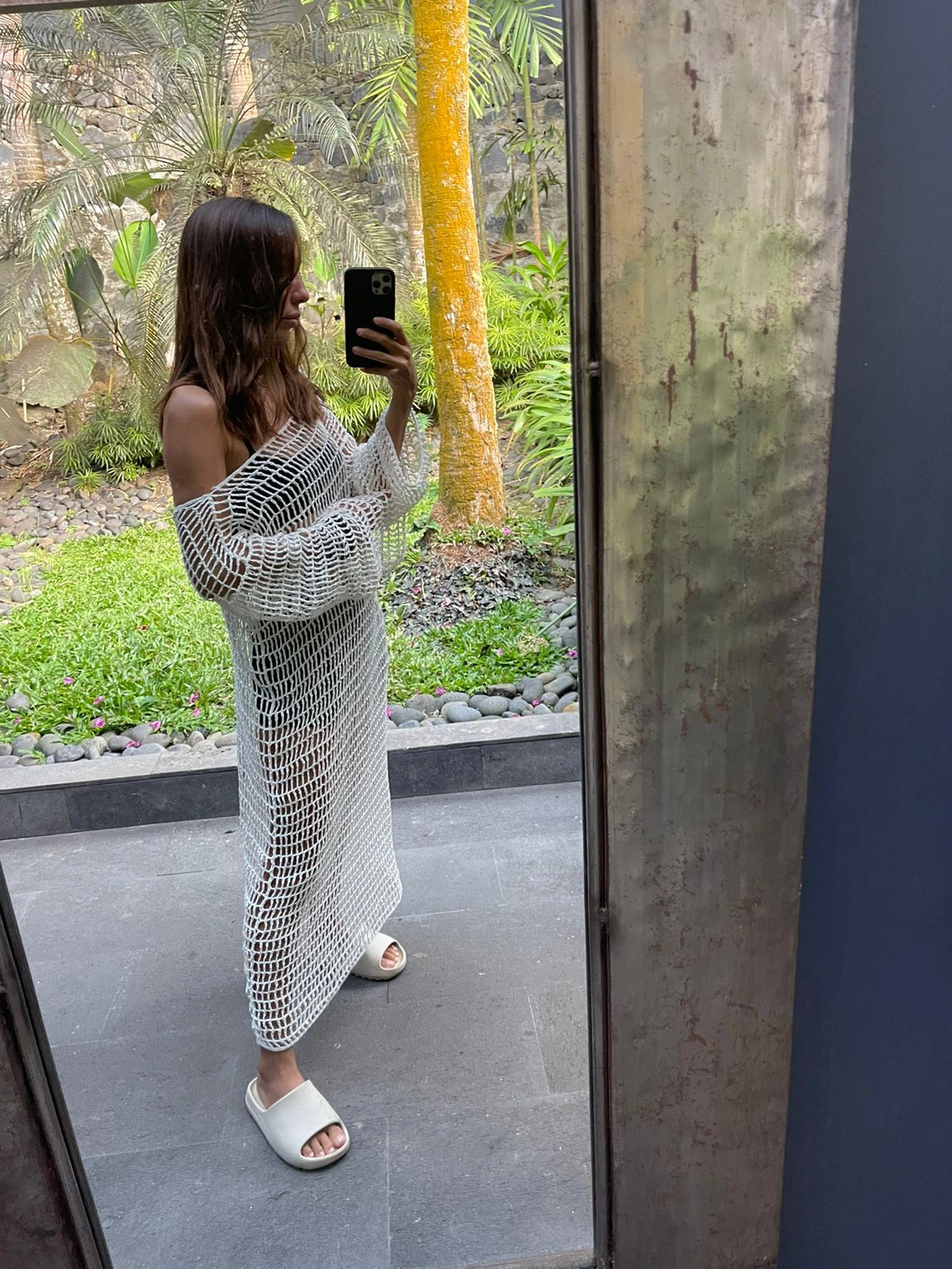 Venila Dress in Ivory - form-fitting long sleeve fishnet crochet midi, front lifestyle view  | NYALA